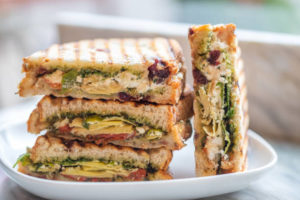 flatbread sandwich slices stacked on plate