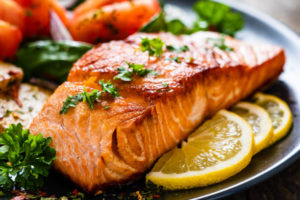 salmon with lemon, parsley, and vegetables