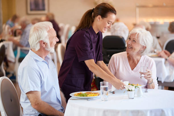 Senior Couple Being Served